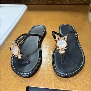 Elegant Black Sandals with Gold Accents